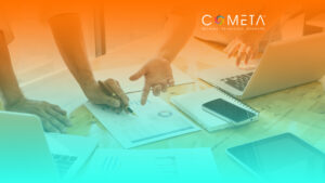 Hands pointing and working over charts and graphs on a wooden table, surrounded by laptops, a smartphone, and a tablet, symbolizing collaboration and strategic vision. The image features an orange-to-teal gradient overlay with the COMETA logo and slogan 'Rethink. Reimagine. Reshape.